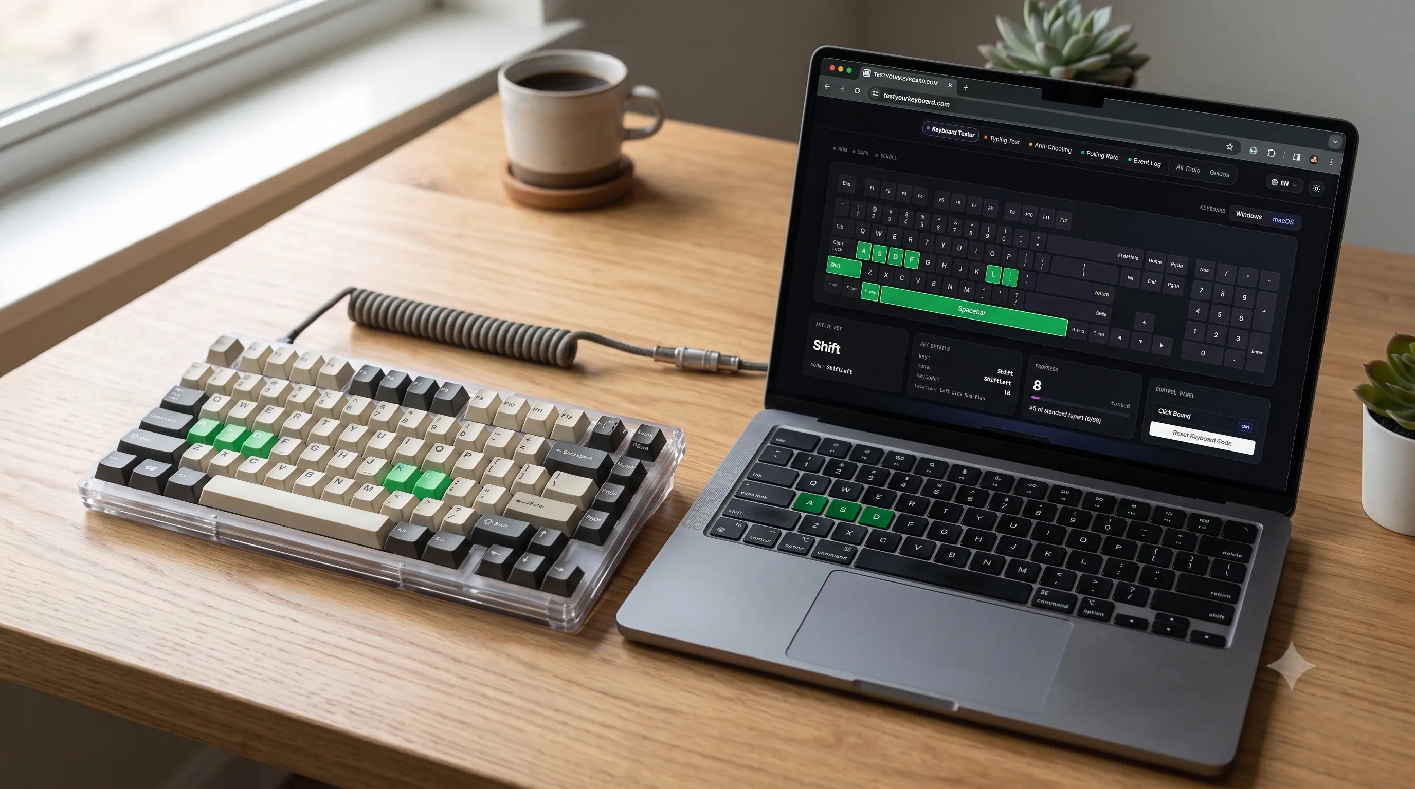 A newly built mechanical keyboard on a desk next to a laptop showing an on-screen keyboard test in the browser